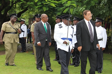 Deputy Governor General His Honour Eustace John inspects the Guard of Honour accompanied by Premier of Nevis Hon. Joseph Parry (second row left) and Commander of the Nevis Police Division Superintendent Hilroy Brandy (extreme left) at the grounds of the Nevis Island Assembly, moments before he delivered the Throne Speech